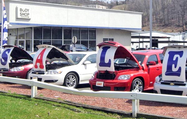 new cars parked on dealer