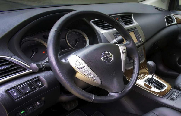 <strong>Nissan Sentra 2013 front, dashboard and steering wheel.</strong>.