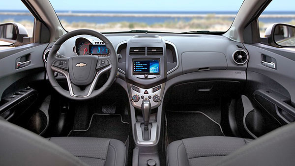 orange 2013 chevrolet sonic Interior - front seats.