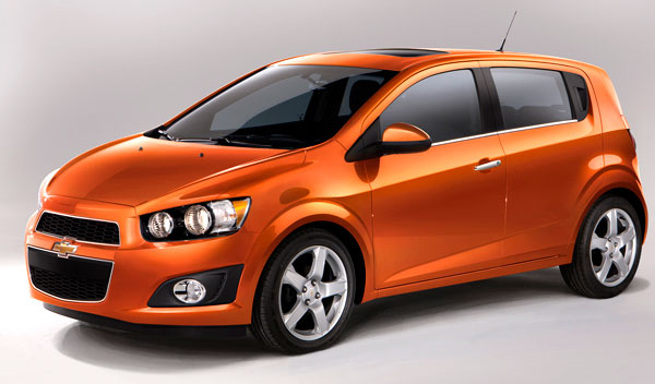 orange 2013 chevrolet sonic hatchback